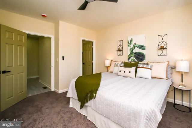 a bedroom with a bed and a chair