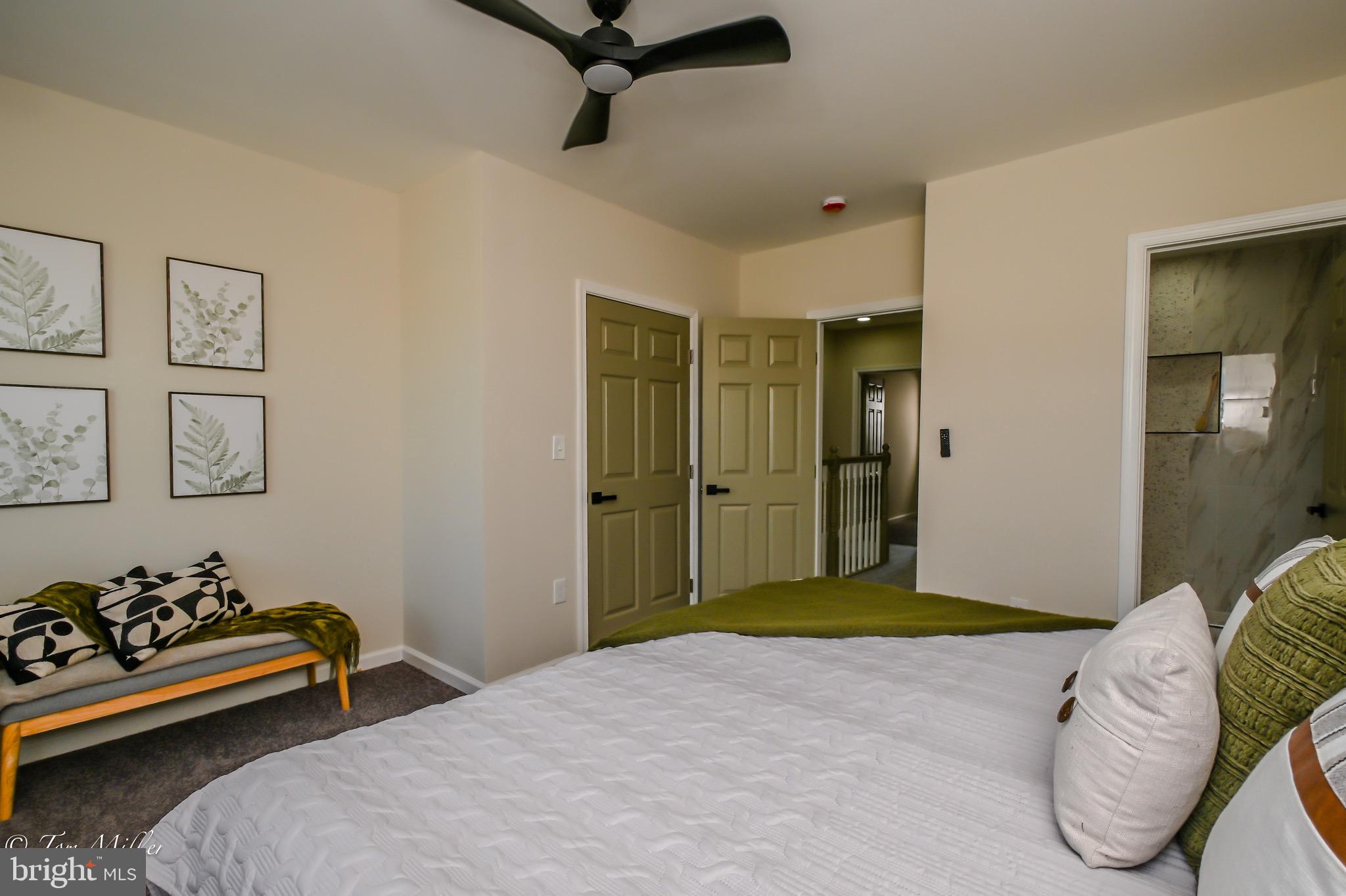 1743 Federal Street Baltimore, MD 21213 - Photo 16 of 42 a bedroom with a bed and a couch