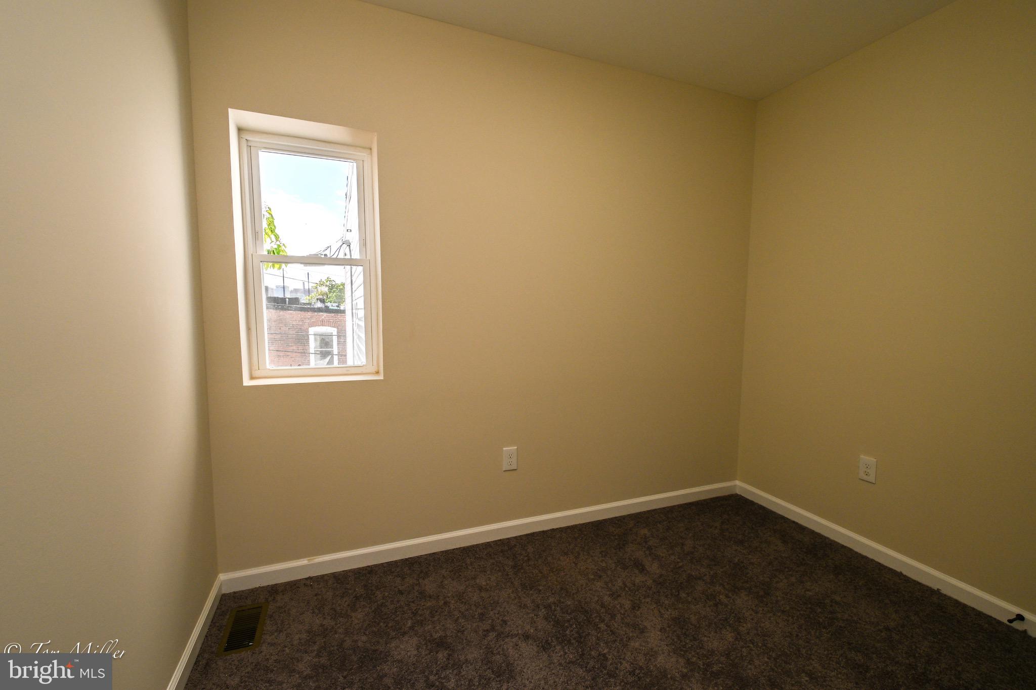 1743 Federal Street Baltimore, MD 21213 - Photo 22 of 42 an empty room with a window