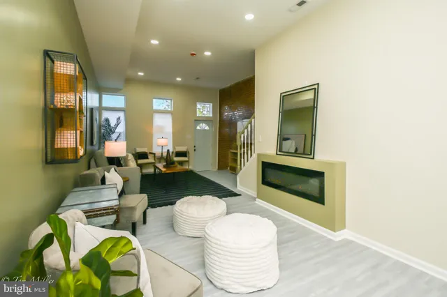 a spacious bathroom with a granite countertop sink and a mirror