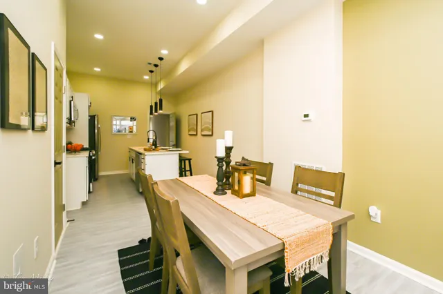 a dining room with a table and chairs