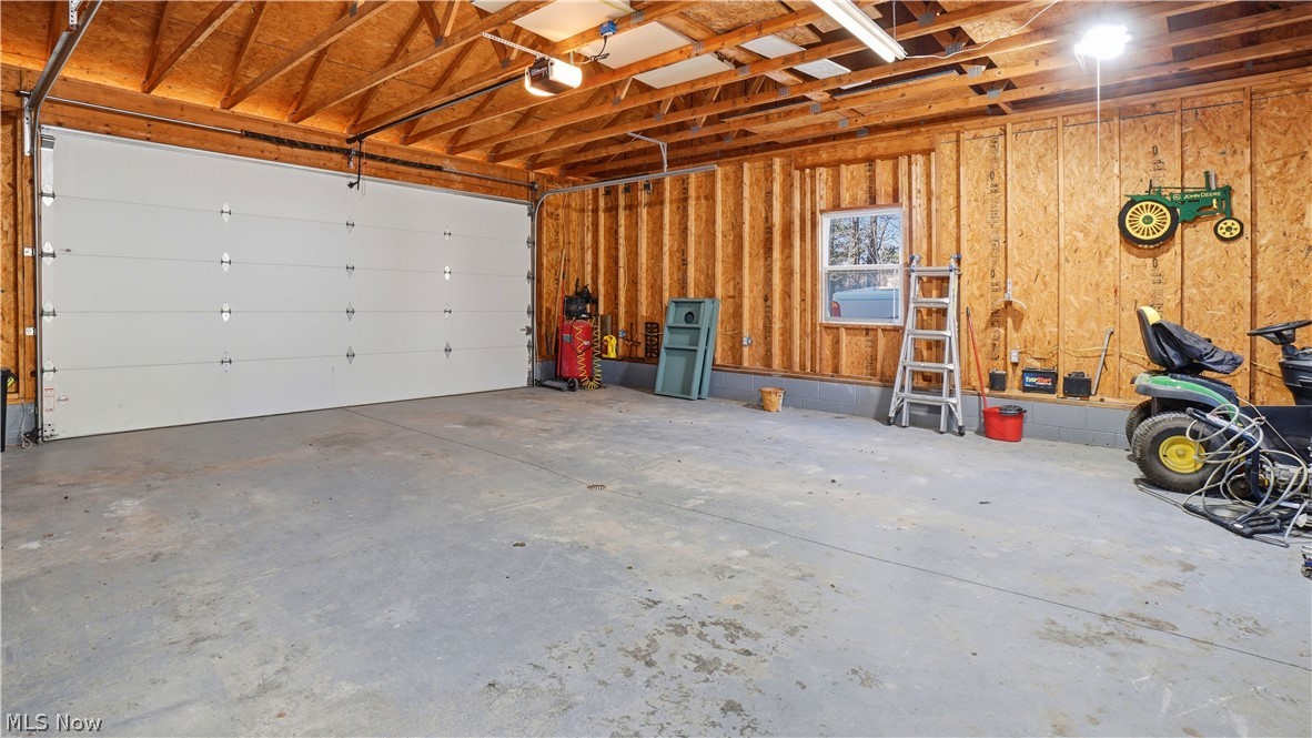 65892 Endley Road Cambridge, OH 43725 - Photo 43 of 50 Garage featuring a garage door opener