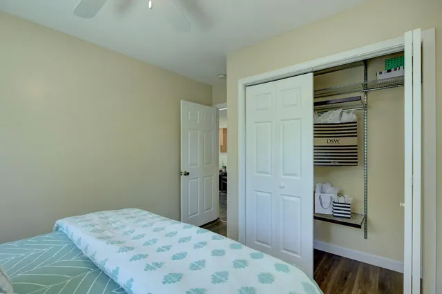 a bedroom with a bed and a bathroom