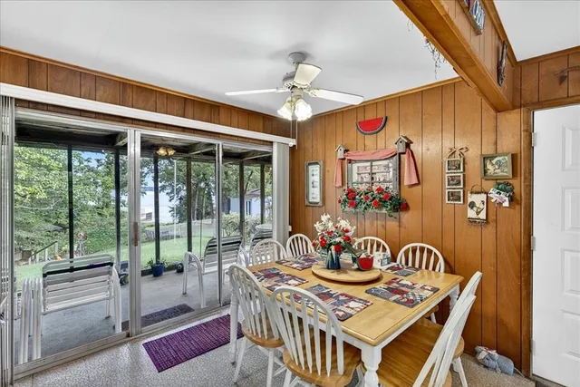a view of a dining table and chairs in the balcony