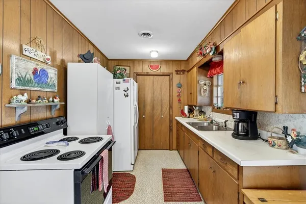 a kitchen with stainless steel appliances a stove and a refrigerator