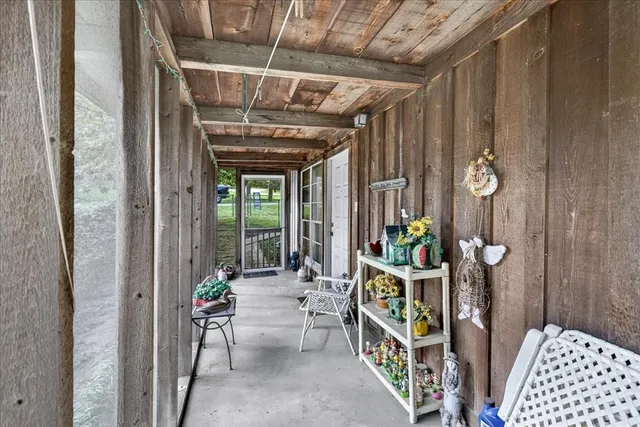 a view of an entryway with outdoor seating