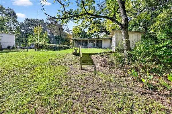 a view of a backyard with a garden