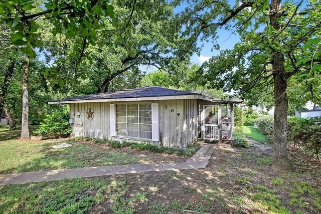 front view of a house with a yard