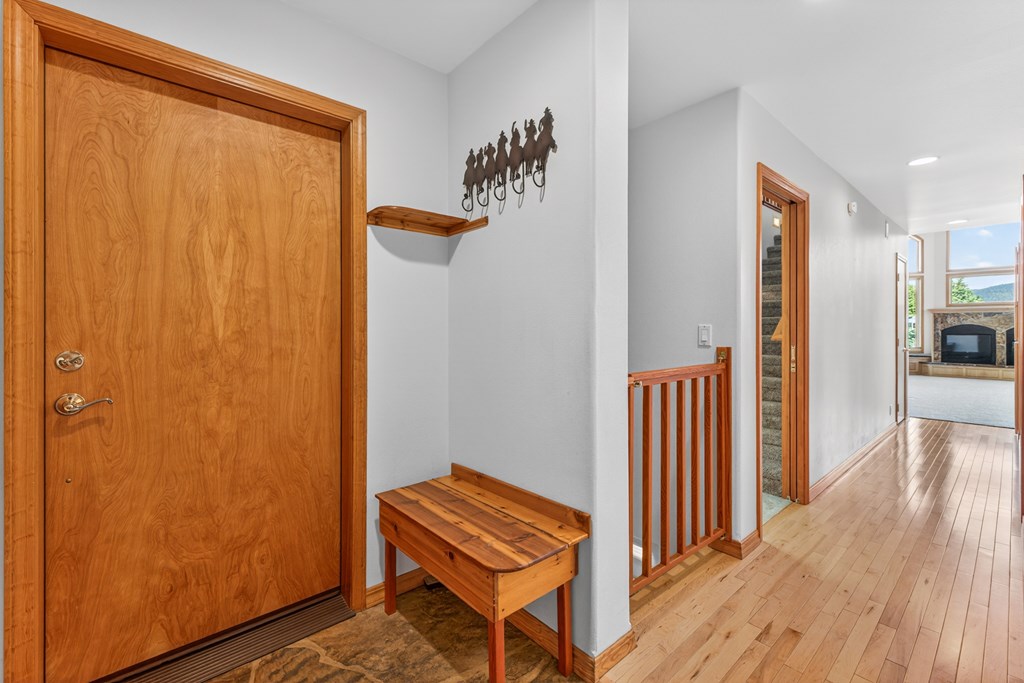 1999 Vardon Road New Meadows, ID 83654 - Photo 15 of 46 Hallway steps to Lower level/steps to upper loft, Hardwood floors