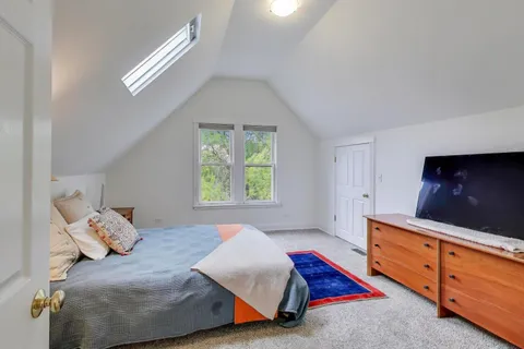 a bedroom with a bed and a cabinets