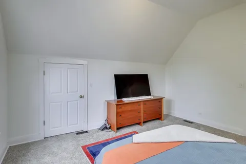 a spacious bathroom with a sink and a mirror