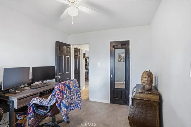 a room with furniture a air conditioner and a window