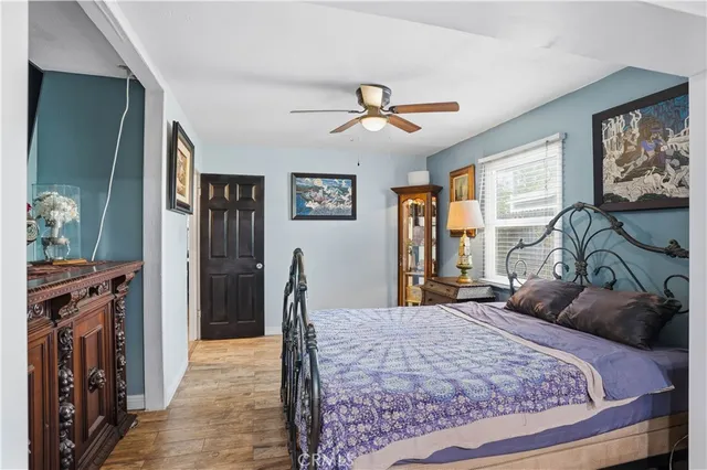 a view of bathroom with a toilet sink and mirror