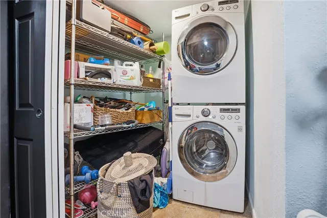 a kitchen with stainless steel appliances granite countertop a stove a sink and a wooden cabinets