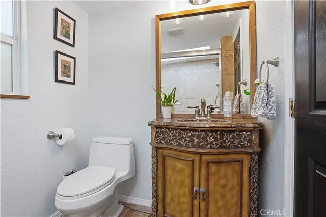 a kitchen with stainless steel appliances granite countertop a stove microwave and sink