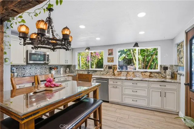 a view of front door with washer and dryer