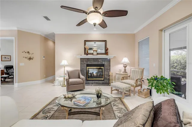 a bedroom with a bed and ceiling fan