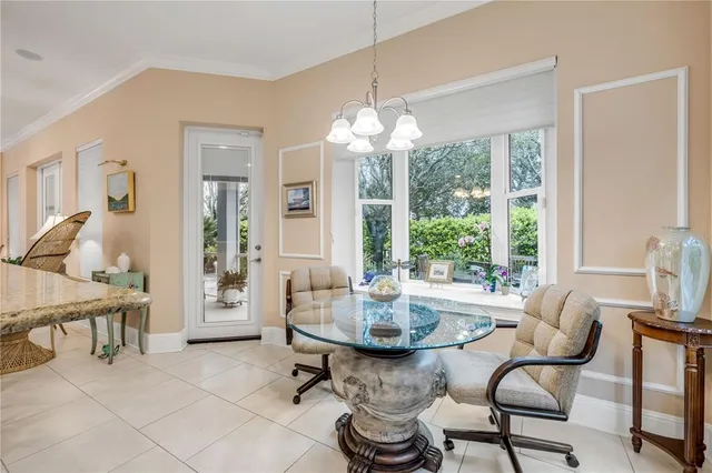 a view of a porch with furniture and a yard