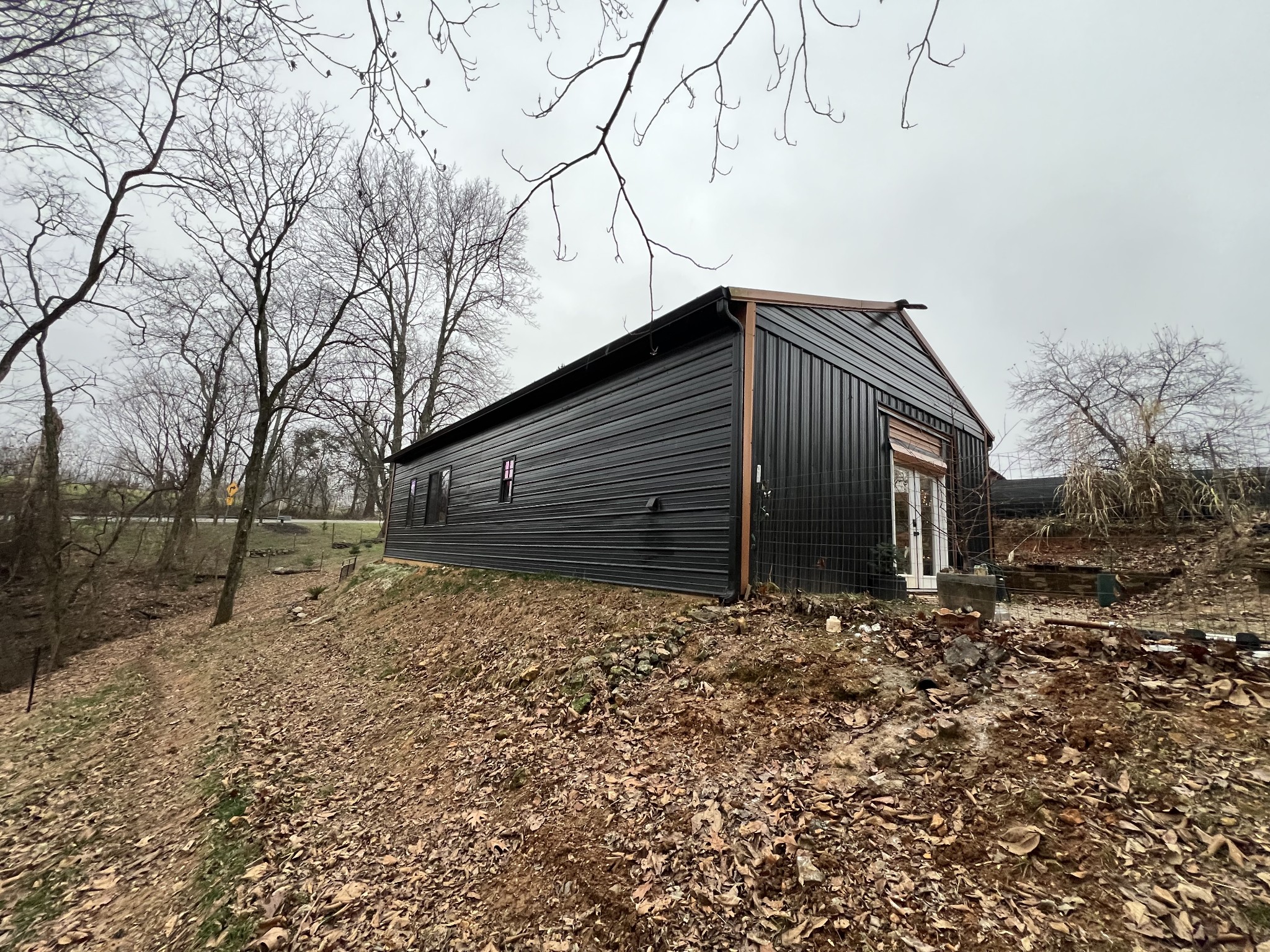 75 New Harmony Road Lafayette, TN 37083 - Photo 6 of 45 a house with trees in front of it