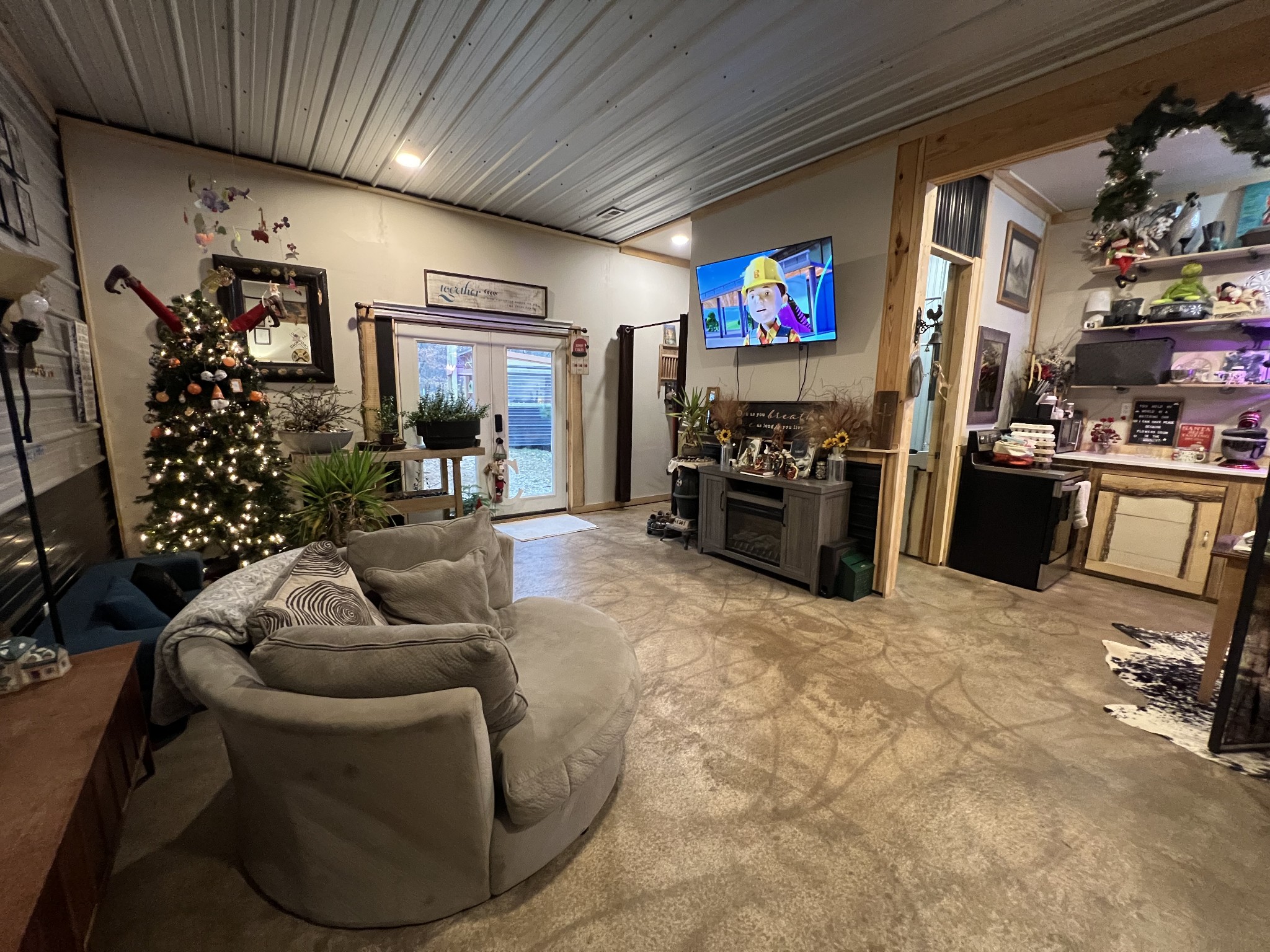 75 New Harmony Road Lafayette, TN 37083 - Photo 8 of 45 a living room with furniture and a flat screen tv