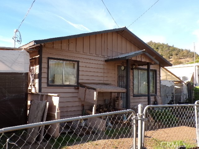 175 Butler Street Clearlake Oaks, CA 95423 - Photo 1 of 5 a front view of house yard with wooden fence