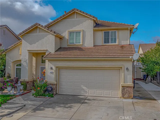 a view of a house with a yard and plants