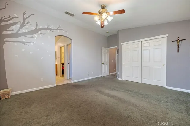 a view of a livingroom with a chandelier fan