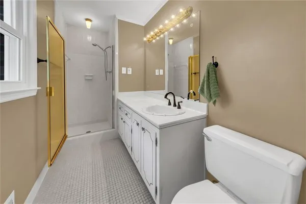 a bedroom with furniture and a window