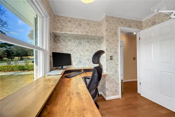 a bedroom with a large bed and a large window