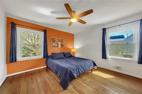 a bedroom with a bed and a table