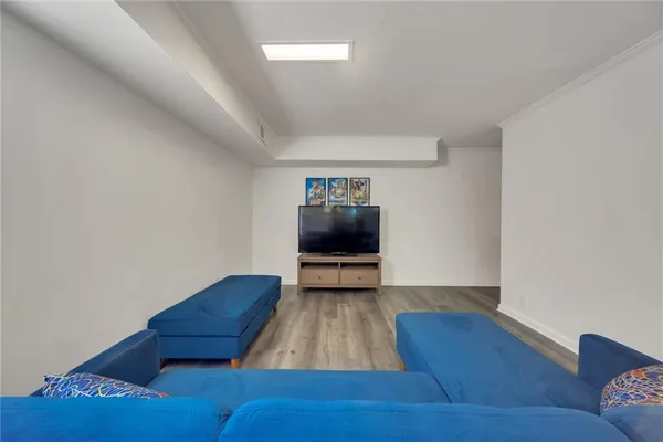 a view of a livingroom with furniture and wooden floor