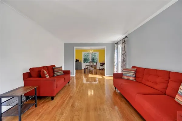 a blue couch sitting in a living room with a couch