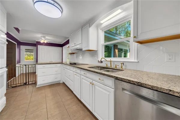 a kitchen with appliances and cabinets