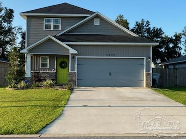 5845 Fairlands Road Milton, FL 32583 - Photo 1 of 21 a front view of a house with a yard