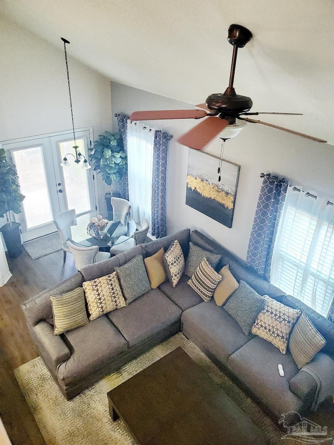 5845 Fairlands Road Milton, FL 32583 - Photo 17 of 21 a living room with furniture and a wooden floor
