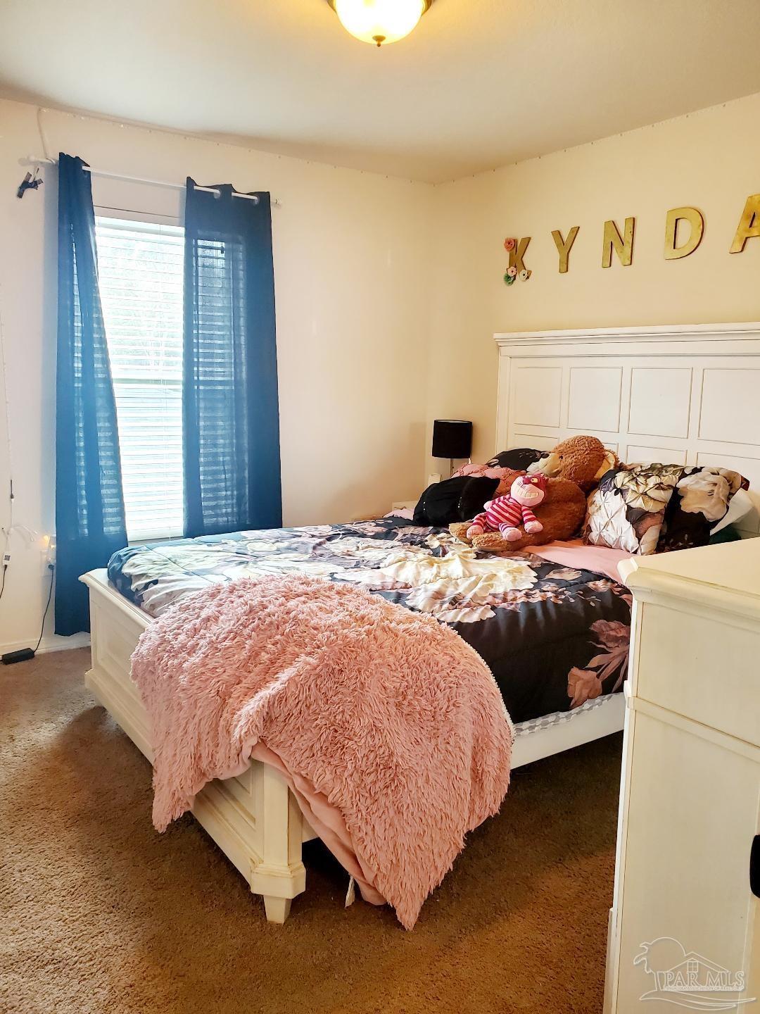 5845 Fairlands Road Milton, FL 32583 - Photo 20 of 21 a bedroom with a bed and dresser