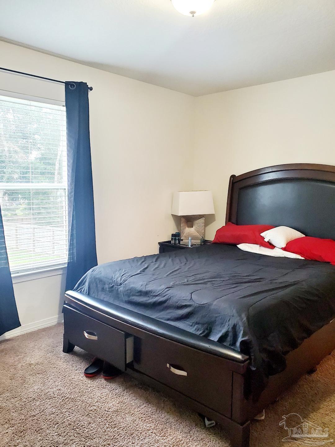 5845 Fairlands Road Milton, FL 32583 - Photo 21 of 21 a bedroom with a bed and window