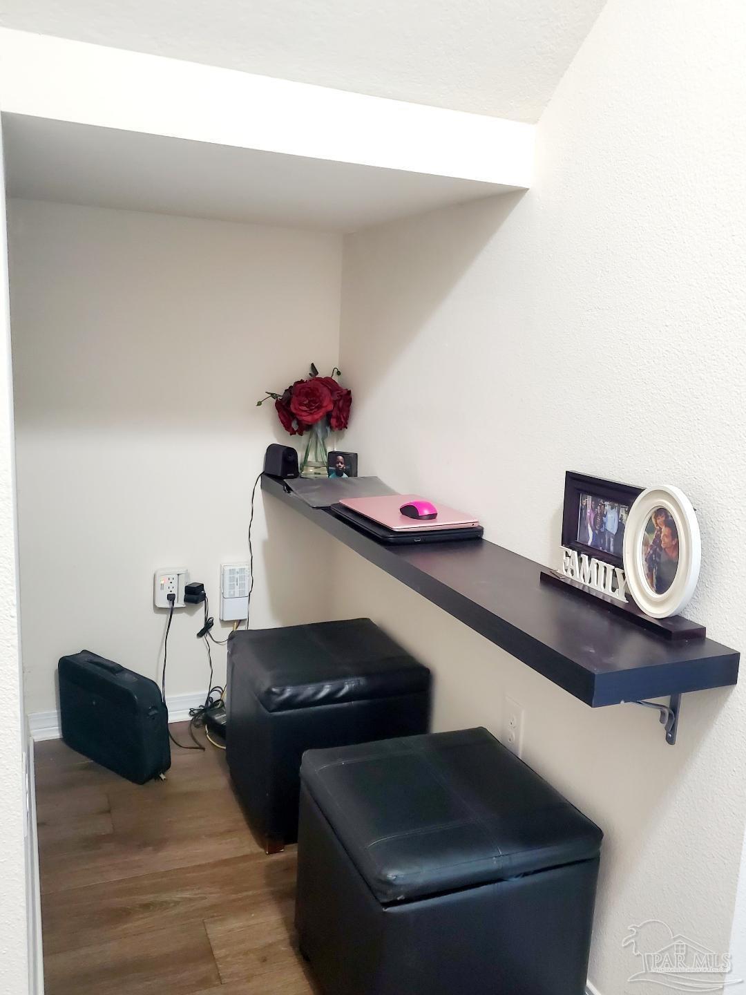 5845 Fairlands Road Milton, FL 32583 - Photo 5 of 21 a living room with furniture and a table