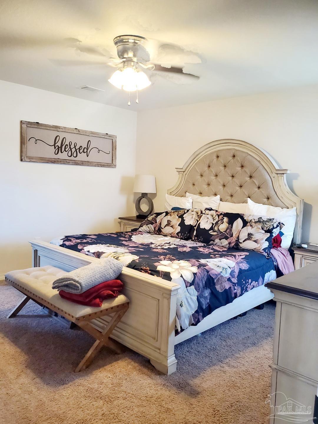 5845 Fairlands Road Milton, FL 32583 - Photo 10 of 21 a living room with furniture and a table