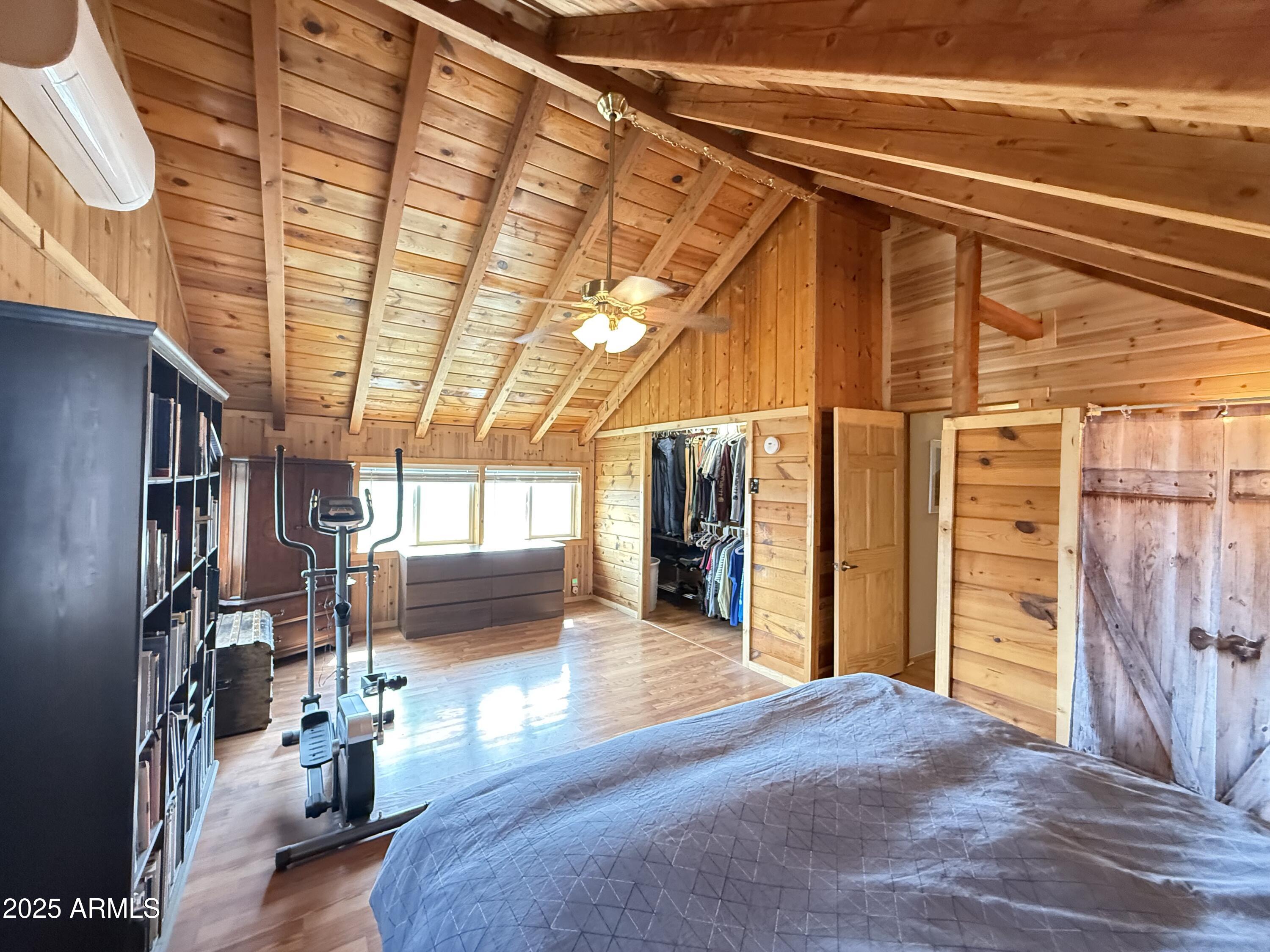 23442 Manzanita Road Crown King, AZ 86343 - Photo 23 of 41 a view of empty room with wooden floor and windows