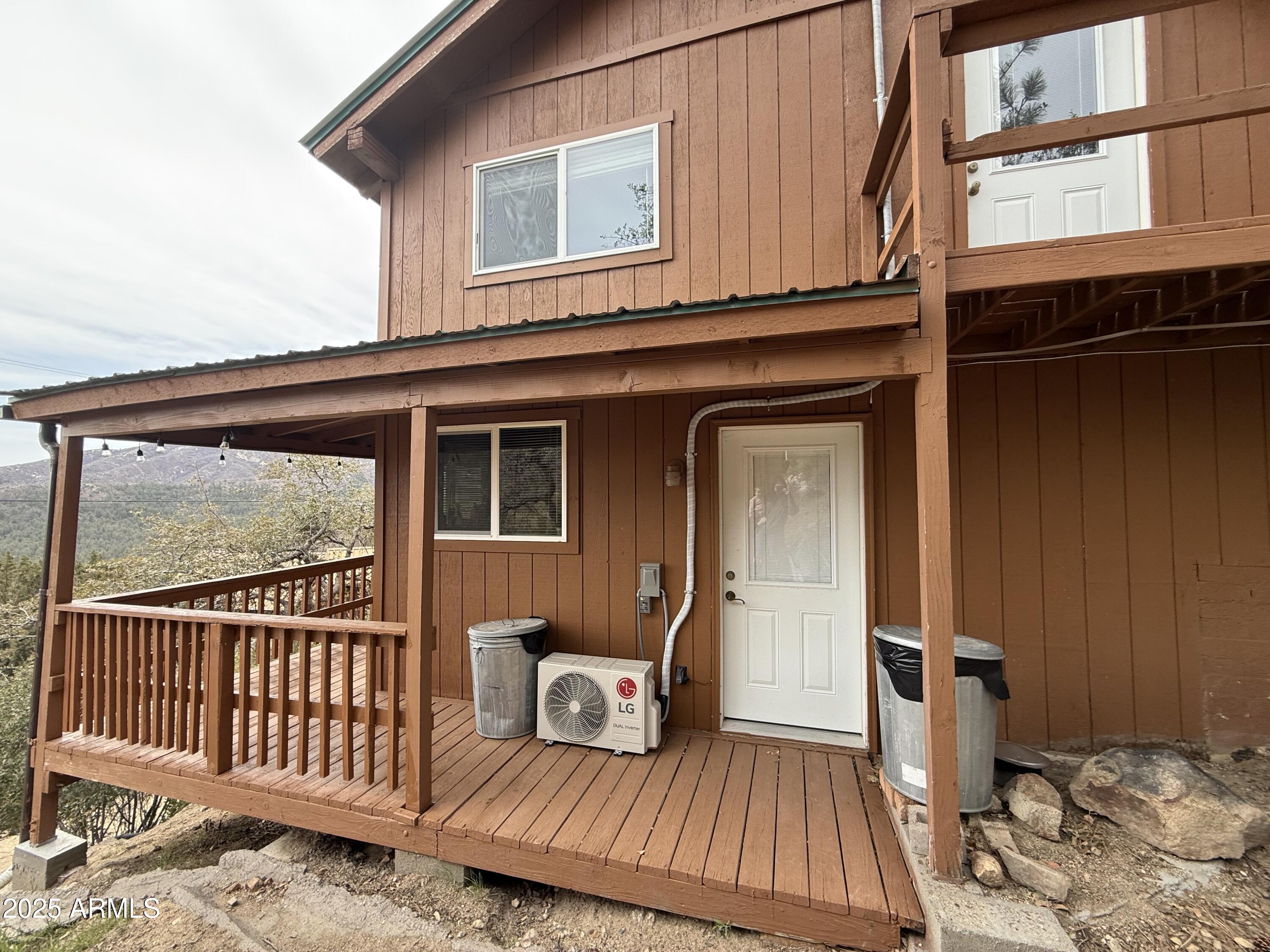 23442 Manzanita Road Crown King, AZ 86343 - Photo 34 of 41 a view of a house with wooden floor