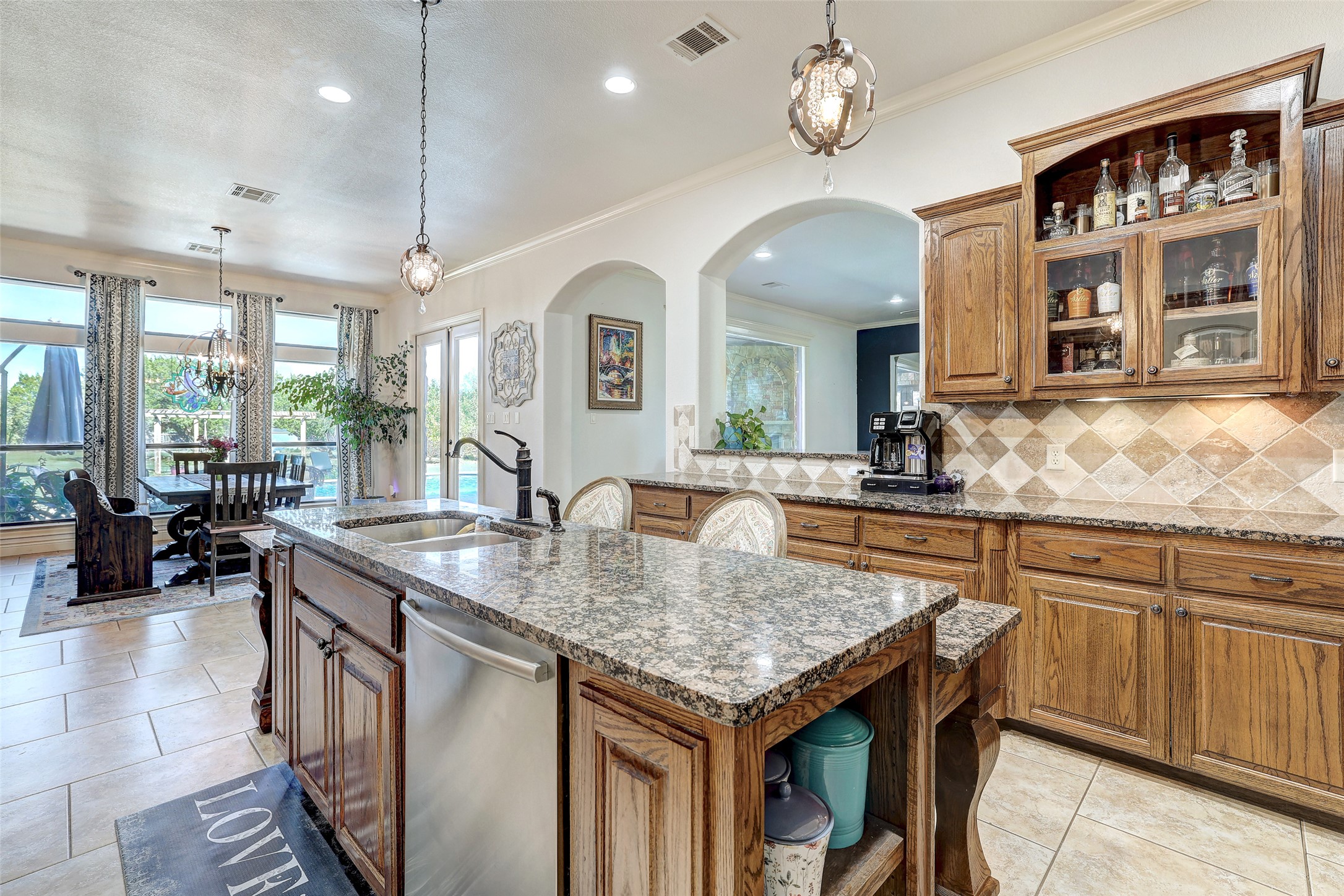 Undisclosed Address Georgetown, TX 78633 - Photo 20 of 39 a kitchen with center island table and chairs in it