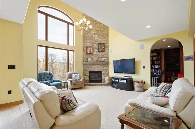 a living room with fireplace furniture and a flat screen tv