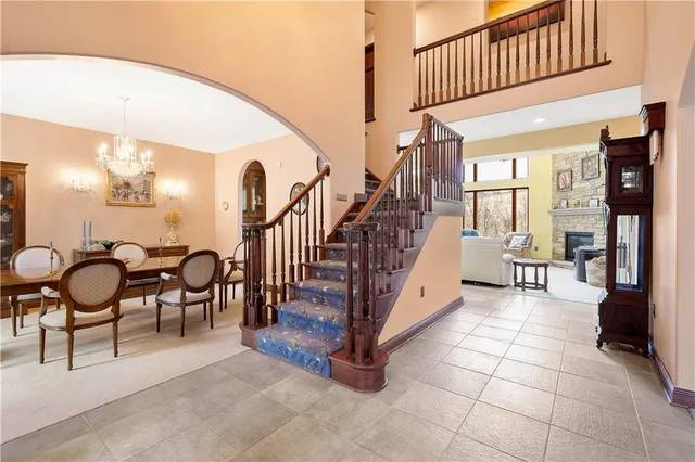 a view of a livingroom with furniture and staircase