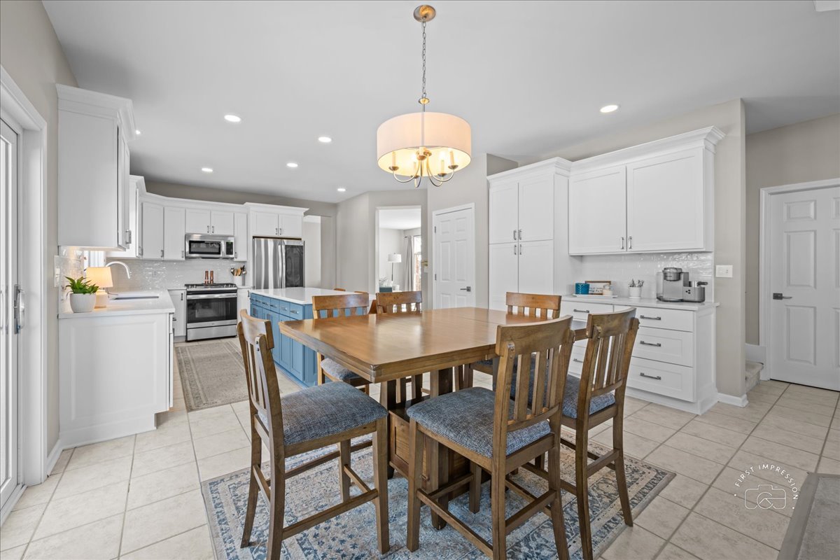 N160 Yates Place Geneva, IL 60134 - Photo 11 of 30 a view of a dining room and kitchen with a table chairs