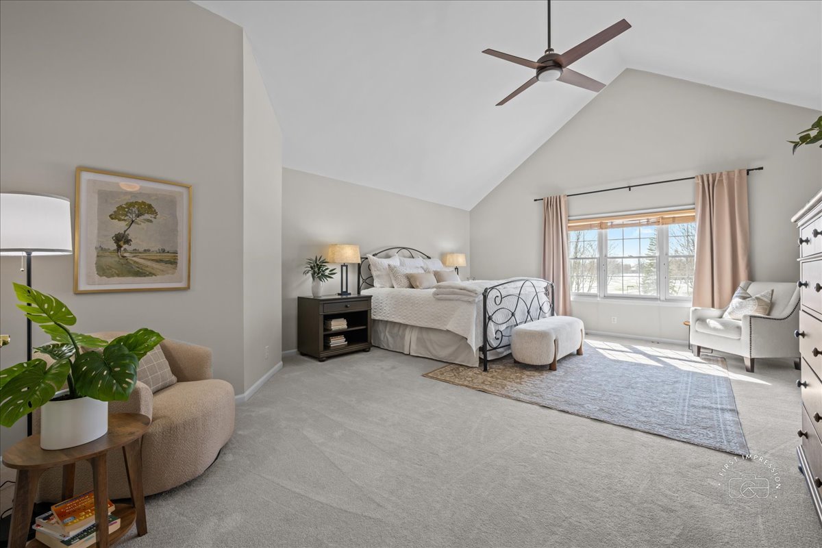 N160 Yates Place Geneva, IL 60134 - Photo 17 of 30 a spacious bedroom with a bed and a couch