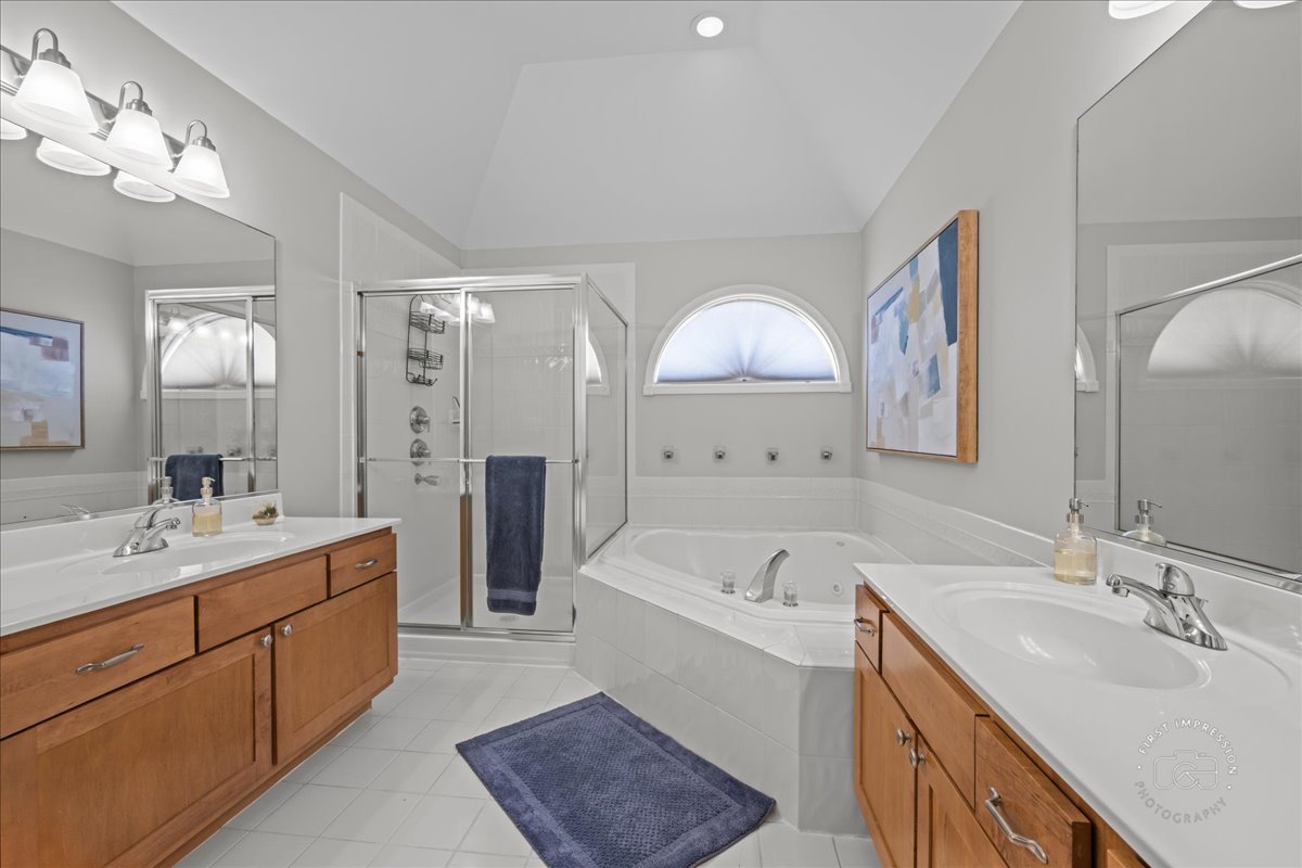 N160 Yates Place Geneva, IL 60134 - Photo 18 of 30 a spacious bathroom with a double vanity sink mirror double and bathtub