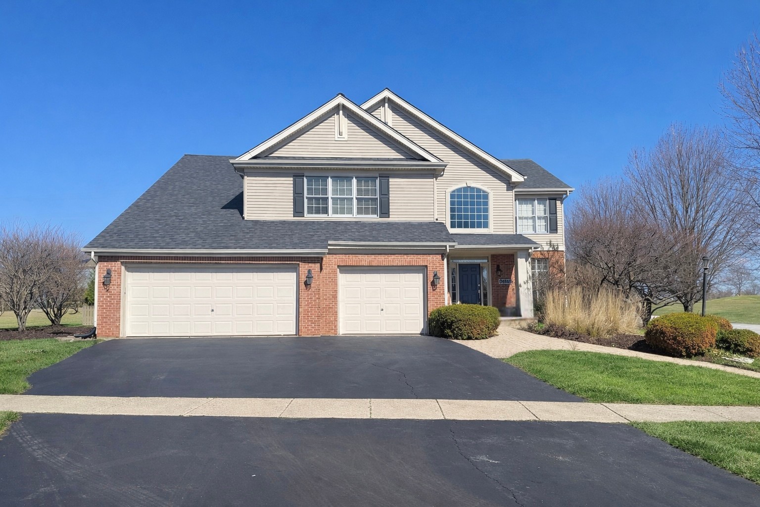 N160 Yates Place Geneva, IL 60134 - Photo 2 of 30 a front view of a house with yard and trees