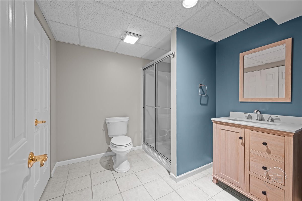 N160 Yates Place Geneva, IL 60134 - Photo 25 of 30 a bathroom with a toilet sink and mirror