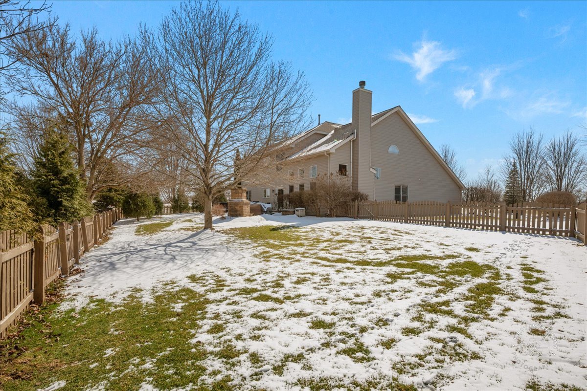 N160 Yates Place Geneva, IL 60134 - Photo 26 of 30 a view of large house with a yard covered with snow